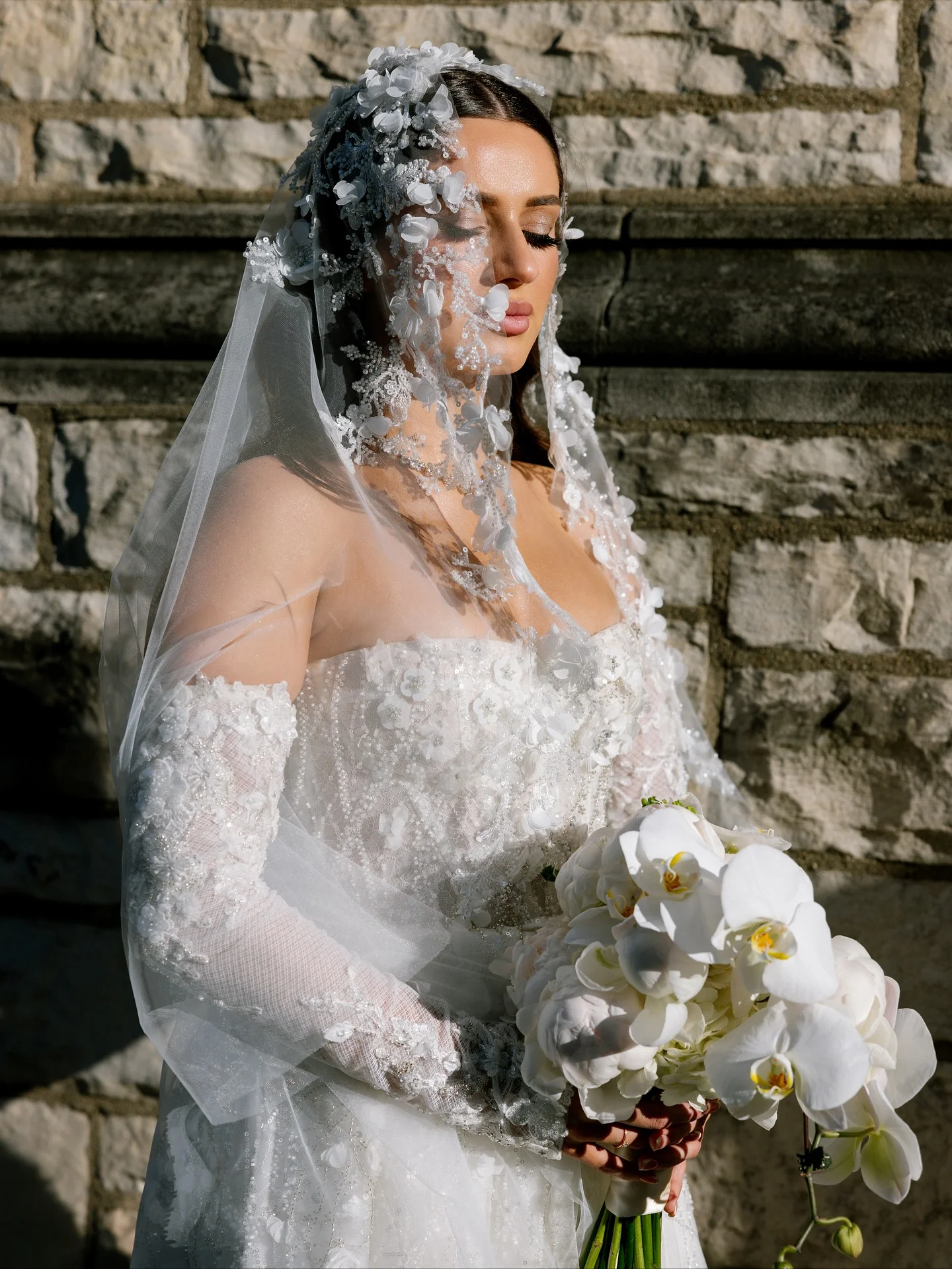 A bride with orchids, photographed by Andrii Vernyi